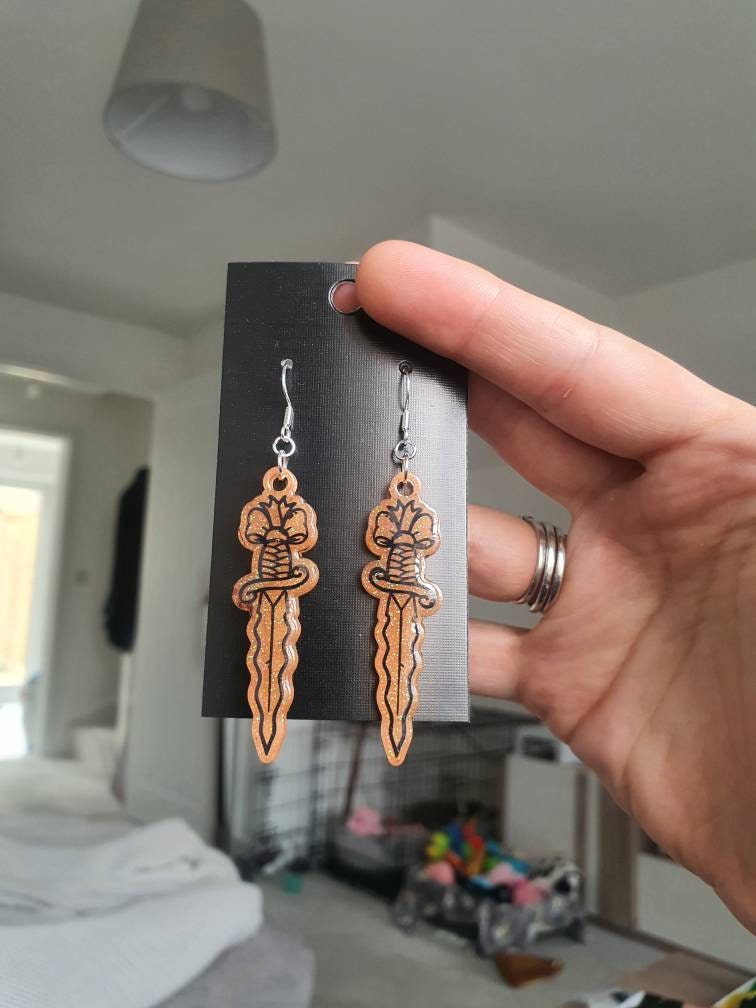 UV Active Glow Orange Wavy Dagger Resin Earrings