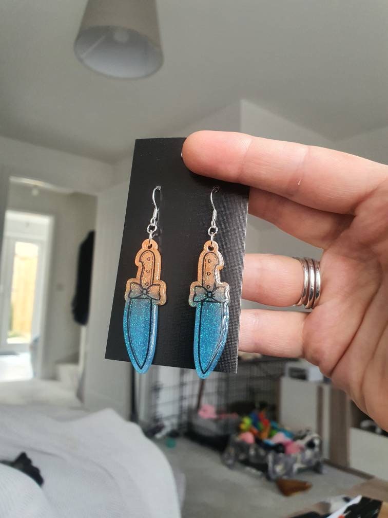 UV Active Glow Orange & Blue Bow Knife Resin Earrings