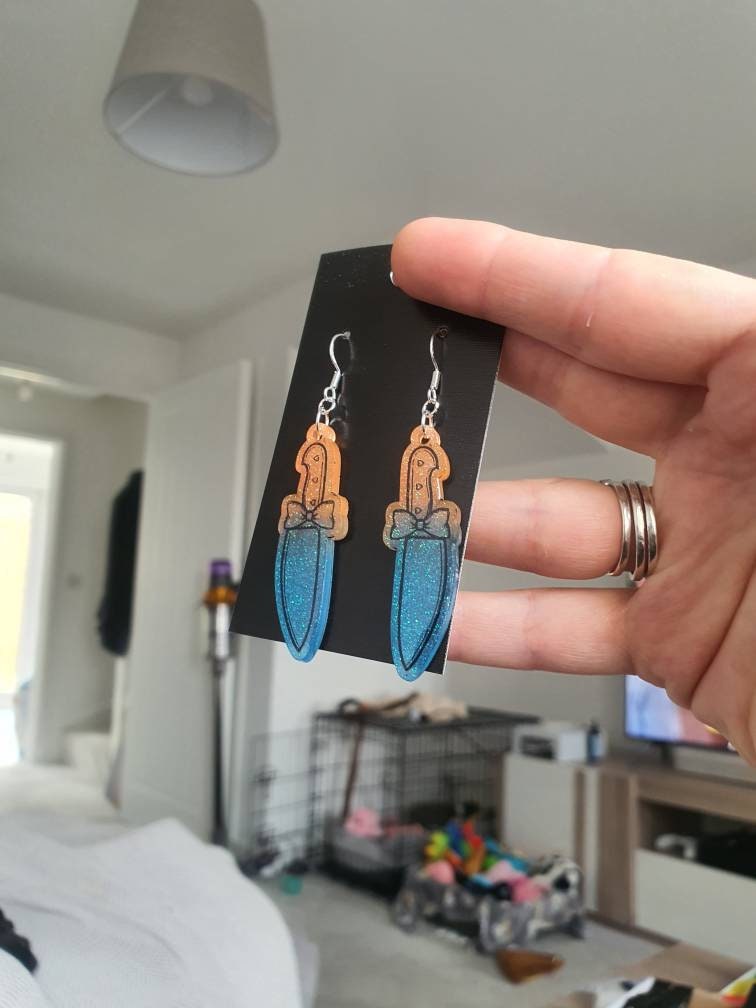 UV Active Glow Orange & Blue Bow Knife Resin Earrings