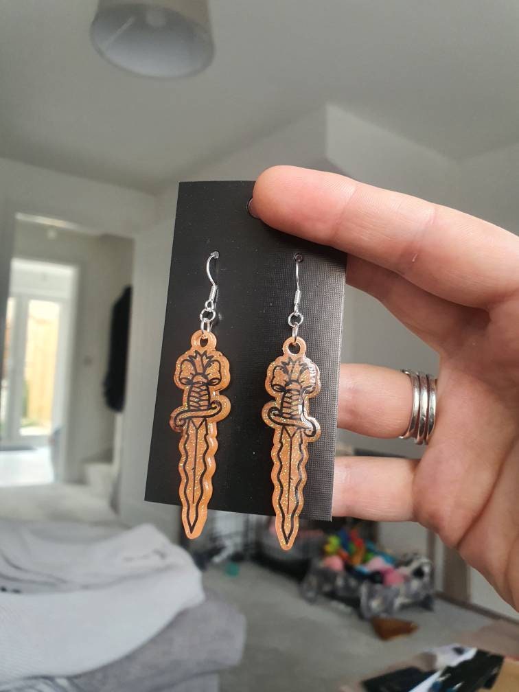 UV Active Glow Orange Wavy Dagger Resin Earrings