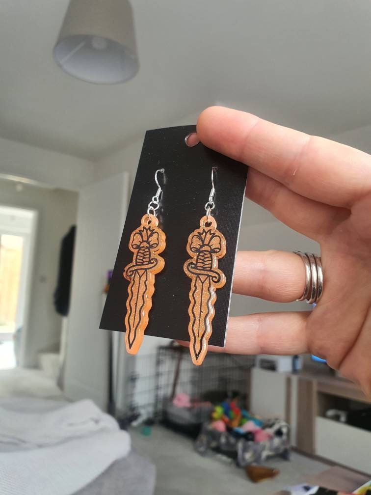UV Active Glow Orange Wavy Dagger Resin Earrings