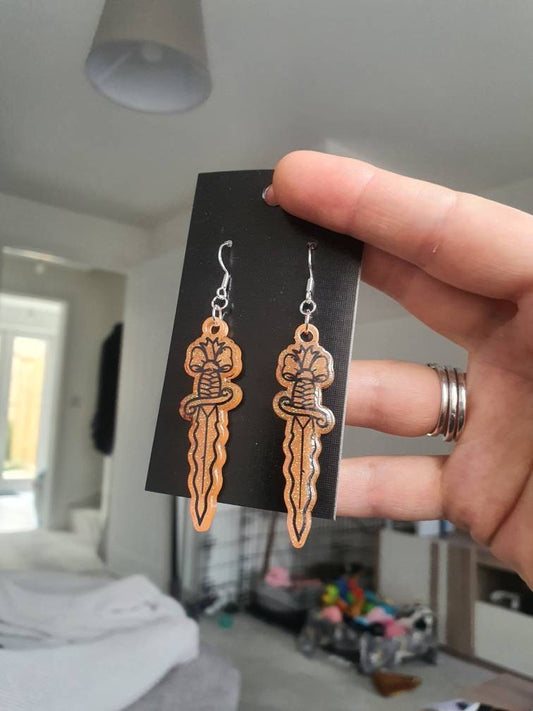 UV Active Glow Orange Wavy Dagger Resin Earrings